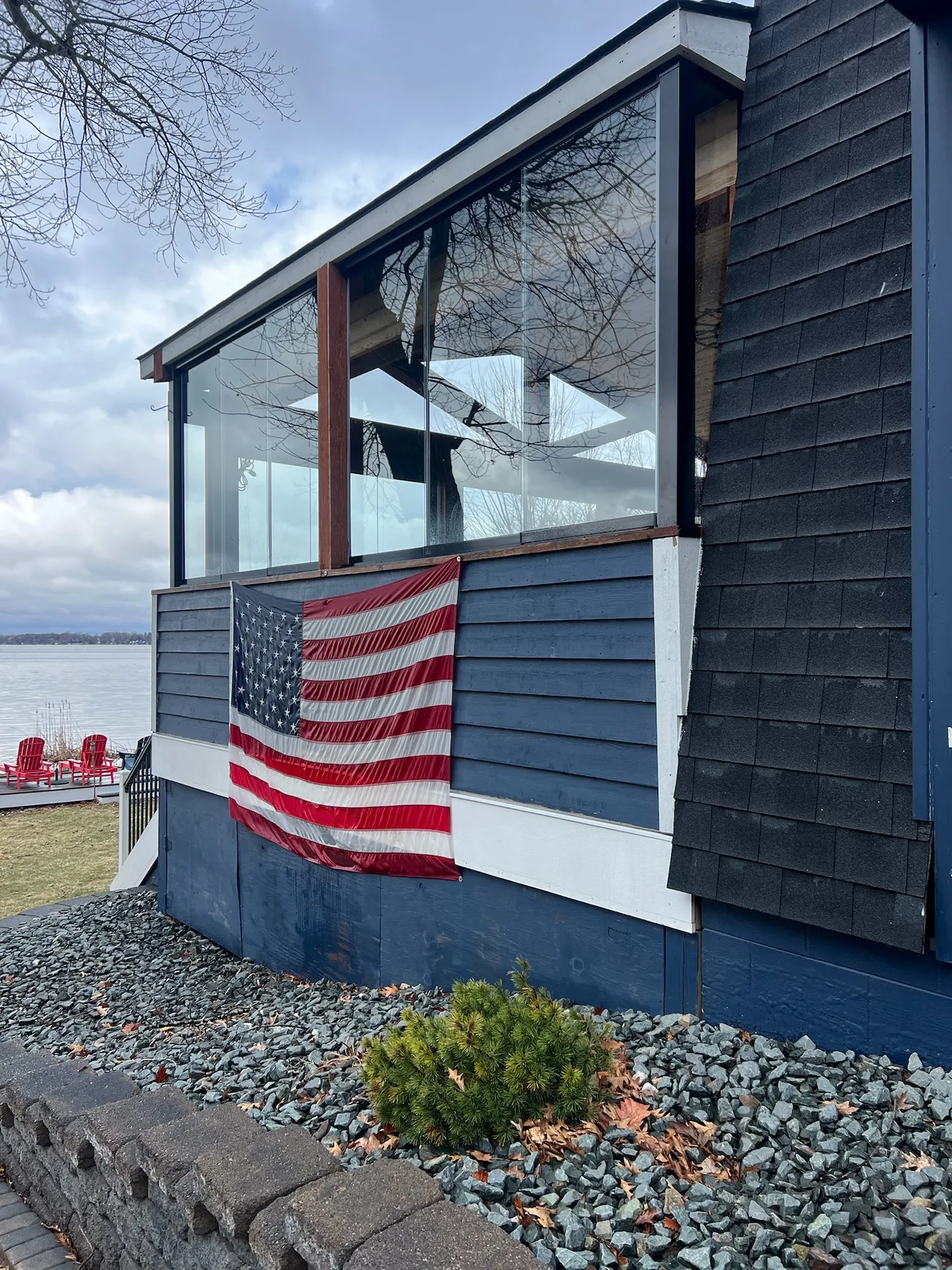 Lake cottage with a timber glass porch